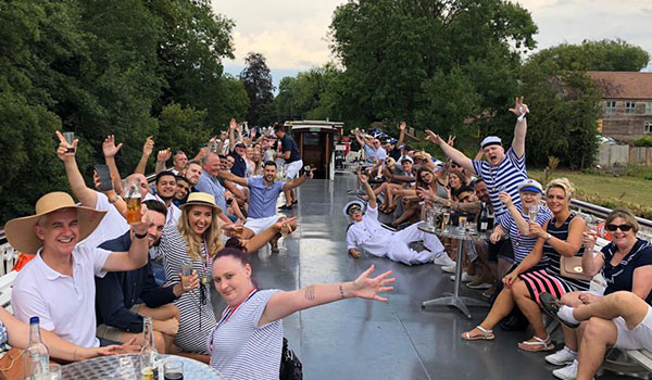 5G Comms team on a work outing on a boat